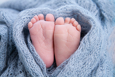 Baby Feet sticking out of a blanket